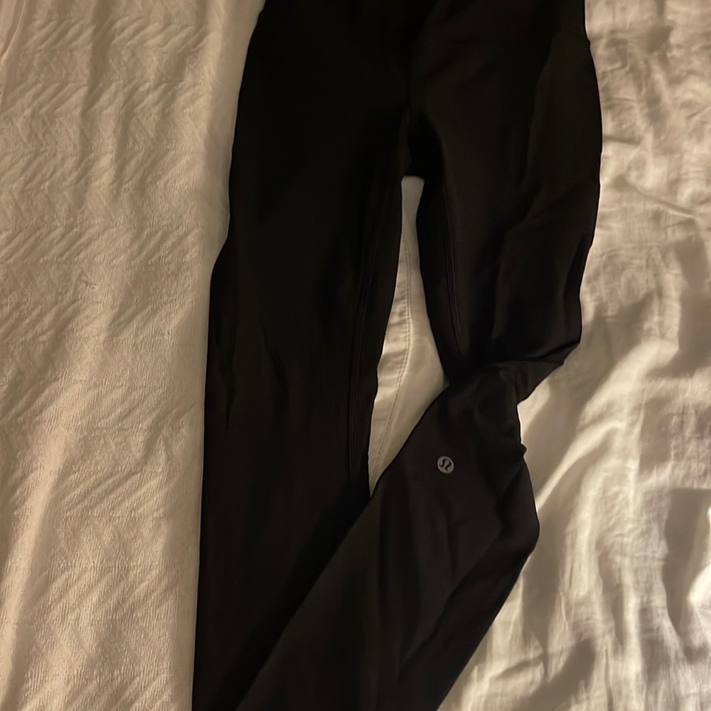 Black Lululemon leggings with dot design on ankle